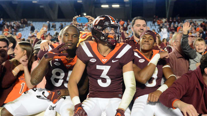 Oct 13, 2018; Chapel Hill, NC, USA; Virginia Tech Hokies defensive back Caleb Farley (3) tight end Chris Cunningham (85) and wide receiver Phil Patterson (8) celebrate with fans after a win against the North Carolina Tar Heels at Kenan Memorial Stadium. The Hokies won 22-19. Mandatory Credit: Rob Kinnan-Imagn Images Oct 13, 2018; Chapel Hill, NC, USA; Virginia Tech Hokies defensive back Caleb Farley (3) tight end Chris Cunningham (85) and wide receiver Phil Patterson (8) celebrate with fans after a win against the North Carolina Tar Heels at Kenan Memorial Stadium. The Hokies won 22-19. Mandatory Credit: Rob Kinnan-Imagn Images
