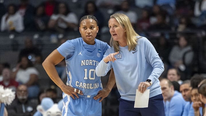 Mar 28, 2025; Birmingham, AL, USA; North Carolina Tar Heels head coach Courtney Banghart works with guard Reniya Kelly (10) during the Sweet 16 NCAA Tournament basketball game against the Duke Blue Devils at Legacy Arena. 