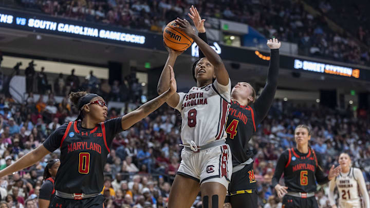 Mar 28, 2025; Birmingham, AL, USA; South Carolina Gamecocks forward Joyce Edwards (8) works between Maryland Terrapins guard Shyanne Sellers (0) and forward Allie Kubek (14) to get off a shot during the first half of a Sweet 16 NCAA Tournament basketball game at Legacy Arena. Mandatory Credit: Vasha Hunt-Imagn Images