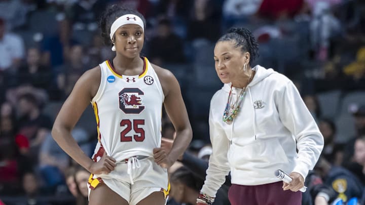 Mar 30, 2025; Birmingham, AL, USA; South Carolina Gamecocks head coach Dawn Staley works with guard Raven Johnson (25) during the first half of an Elite 8 NCAA Tournament basketball game against the Duke Blue Devils at Legacy Arena. Mandatory Credit: Vasha Hunt-Imagn Images
