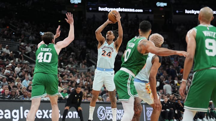 Mar 29, 2025; San Antonio, Texas, USA; San Antonio Spurs guard Devin Vassell (24) shoots over Boston Celtics center Luke Kornet (40) in the first half at Frost Bank Center. Mandatory Credit: Daniel Dunn-Imagn Images Mar 29, 2025; San Antonio, Texas, USA; San Antonio Spurs guard Devin Vassell (24) shoots over Boston Celtics center Luke Kornet (40) in the first half at Frost Bank Center. Mandatory Credit: Daniel Dunn-Imagn Images