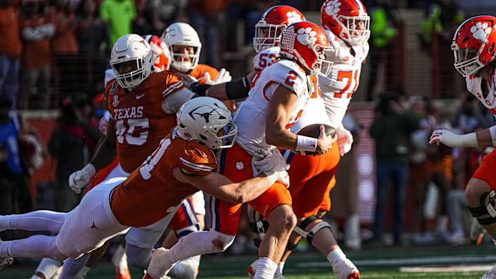 Texas Longhorns edge rusher Ethan Burke (91) sacks Clemson quarterback Cade Klubnik (2) during the game against Clemson in the first round of the College Football Playoffs at Darrell K Royal-Texas Memorial Stadium on Saturday, Dec. 21, 2024. Texas Longhorns edge rusher Ethan Burke (91) sacks Clemson quarterback Cade Klubnik (2) during the game against Clemson in the first round of the College Football Playoffs at Darrell K Royal-Texas Memorial Stadium on Saturday, Dec. 21, 2024.