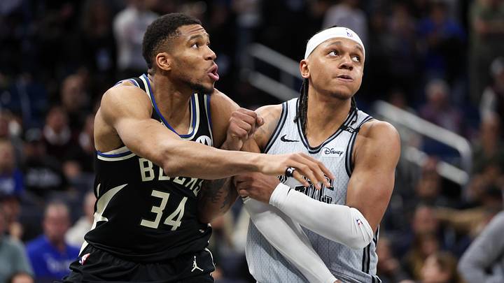 Jan 10, 2025; Orlando, Florida, USA; Milwaukee Bucks forward Giannis Antetokounmpo (34) guards Orlando Magic forward Paolo Banchero (5) in the fourth quarter at Kia Center. Mandatory Credit: Nathan Ray Seebeck-Imagn Images