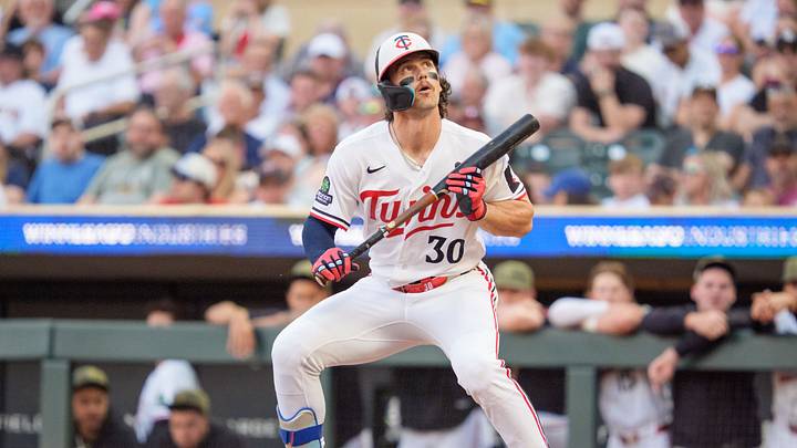 May 15, 2026; Minneapolis, Minnesota, USA; Minnesota Twins left fielder James Outman (30) watches an attempted bunt go foul against the Milwaukee Brewers in the third inning at Target Field. Mandatory Credit: Matt Blewett-Imagn Images
