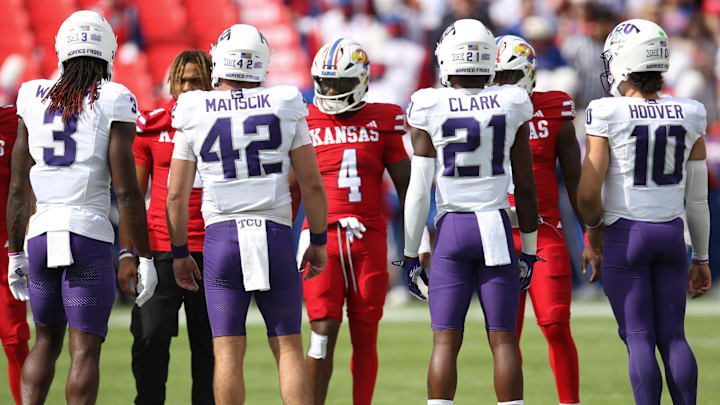 TCU captains meet at midfield at the beginning of the game against Kansas. TCU captains meet at midfield at the beginning of the game against Kansas.