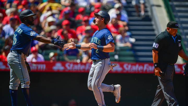 Apr 5, 2026; Anaheim, California, USA; Seattle Mariners second baseman Cole Young (2) is greeted by left fielder Randy Arozarena (56) after both score runs against the Los Angeles Angels during the second inning at Angel Stadium. Mandatory Credit: Gary A. Vasquez-Imagn Images Apr 5, 2026; Anaheim, California, USA; Seattle Mariners second baseman Cole Young (2) is greeted by left fielder Randy Arozarena (56) after both score runs against the Los Angeles Angels during the second inning at Angel Stadium. Mandatory Credit: Gary A. Vasquez-Imagn Images