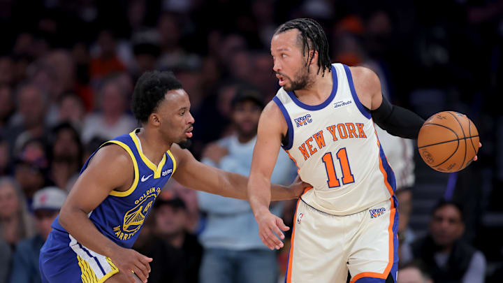 Mar 15, 2026; New York, New York, USA; New York Knicks guard Jalen Brunson (11) controls the ball against Golden State Warriors guard Lj Cryer (18) during the first quarter at Madison Square Garden. Mandatory Credit: Brad Penner-Imagn Images