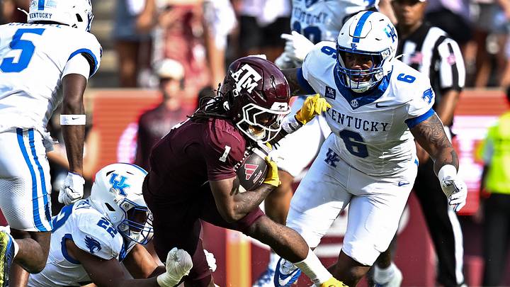 Sep 19, 2026; College Station, Texas, USA; Texas A&M Aggies wide receiver Mario Craver (1) runs the ball as Kentucky Wildcats linebacker Grant Godfrey (22) and defensive tackle Ahmad Breaux (6) make the tackle at Kyle Field. Mandatory Credit: Maria Lysaker-Imagn Images Sep 19, 2026; College Station, Texas, USA; Texas A&M Aggies wide receiver Mario Craver (1) runs the ball as Kentucky Wildcats linebacker Grant Godfrey (22) and defensive tackle Ahmad Breaux (6) make the tackle at Kyle Field. Mandatory Credit: Maria Lysaker-Imagn Images