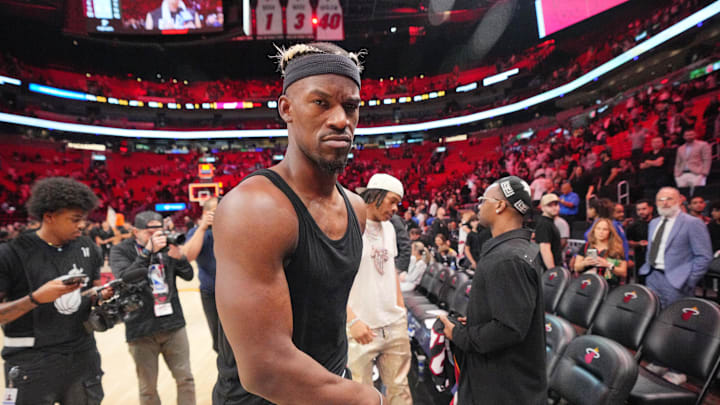 Jan 19, 2025; Miami, Florida, USA;  Miami Heat forward Jimmy Butler (22) walks off the court after greeting court-side friends following the victory over the San Antonio Spurs at Kaseya Center. Mandatory Credit: Jim Rassol-Imagn Images