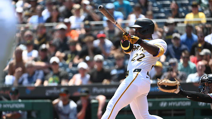 Jun 11, 2025; Pittsburgh, Pennsylvania, USA;  Pittsburgh Pirates designated hitter Andrew McCutchen (22) hits a home run against the Miami Marlins during the fifth inning at PNC Park. The home run was his 241st and putting him ahead of Roberto Clemente on the Pirates all-time home run list with 241. Mandatory Credit: Philip G. Pavely-Imagn Images