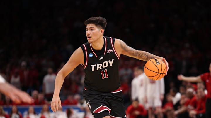 Mar 19, 2026; Oklahoma City, OK, USA; Troy Trojans forward Victor Valdes (11) drives to the hoop during the second half against the Nebraska Cornhuskers during a first round game of the men's 2026 NCAA Tournament at Paycom Center. Mandatory Credit: William Purnell-Imagn Images