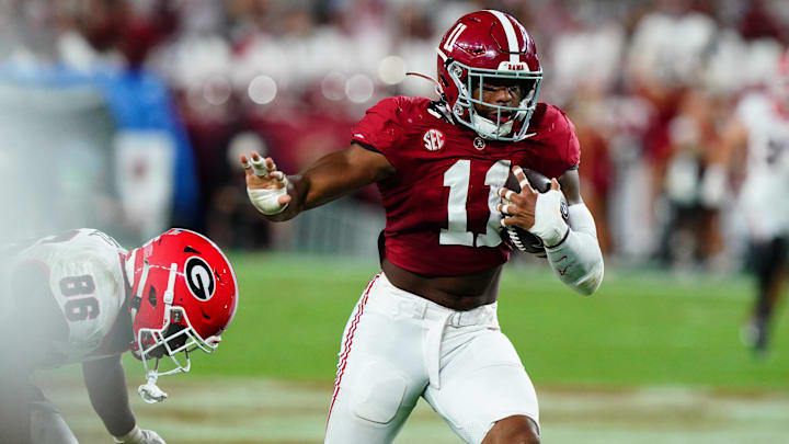 Sep 28, 2024; Tuscaloosa, Alabama, USA;  Alabama Crimson Tide linebacker Jihaad Campbell (11) returns an interception against Georgia Bulldogs wide receiver Dillon Bell (86) during the first half at Bryant-Denny Stadium. Mandatory Credit: John David Mercer-Imagn Images