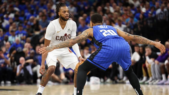 Apr 27, 2024; Orlando, Florida, USA; Orlando Magic guard Markelle Fultz (20) guards Cleveland Cavaliers guard Darius Garland (10) in the fourth quarter during game four of the first round for the 2024 NBA Playoffs at Kia Center.