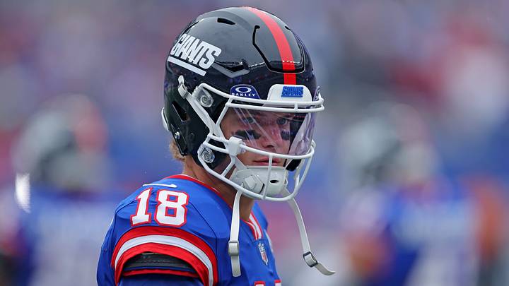Oct 4, 2026; East Rutherford, New Jersey, USA; New York Giants quarterback J.J. McCarthy (18) on the sideline before a game against the Arizona Cardinals at MetLife Stadium.  