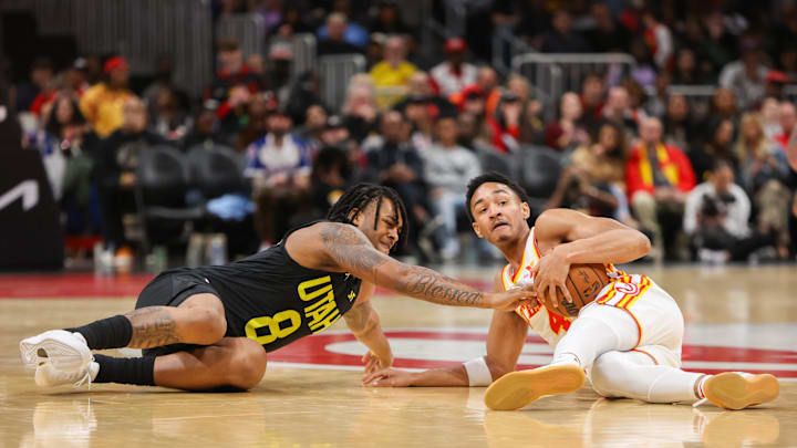 Feb 27, 2024; Atlanta, Georgia, USA; Utah Jazz forward Brice Sensabaugh (8) reaches for a loose ball
