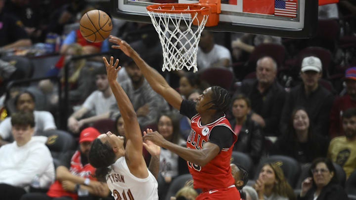 Oct 8, 2024; Cleveland, Ohio, USA; Chicago Bulls forward Julian Phillips (15) defends a shot by Cleveland Cavaliers forward Jaylon Tyson (24) in the fourth quarter at Rocket Mortgage FieldHouse. Mandatory Credit: David Richard-Imagn Images