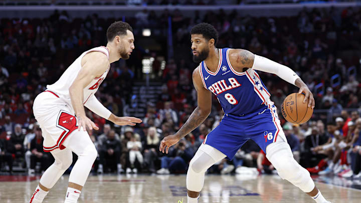 Dec 8, 2024; Chicago, Illinois, USA; Chicago Bulls guard Zach LaVine (8) defends against the Philadelphia 76ers forward Paul George (8) during the second half at United Center. Mandatory Credit: Kamil Krzaczynski-Imagn Images
