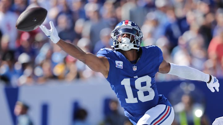 Sep 28, 2025; East Rutherford, New Jersey, USA; New York Giants wide receiver Darius Slayton (18) attempts to make a catch during the second quarter against the Los Angeles Chargers at MetLife Stadium. Sep 28, 2025; East Rutherford, New Jersey, USA; New York Giants wide receiver Darius Slayton (18) attempts to make a catch during the second quarter against the Los Angeles Chargers at MetLife Stadium.