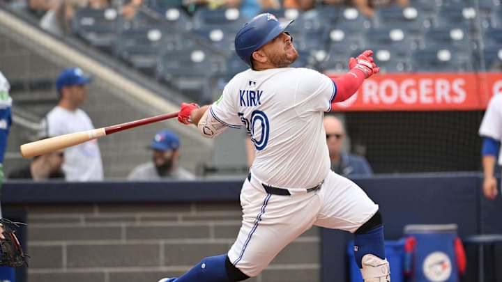 Jun 19, 2025; Toronto, Ontario, CAN;  Toronto Blue Jays catcher Alejandro Kirk (30) hits a solo home run against the Arizona Diamondbacks in the eighth inning at Rogers Centre.