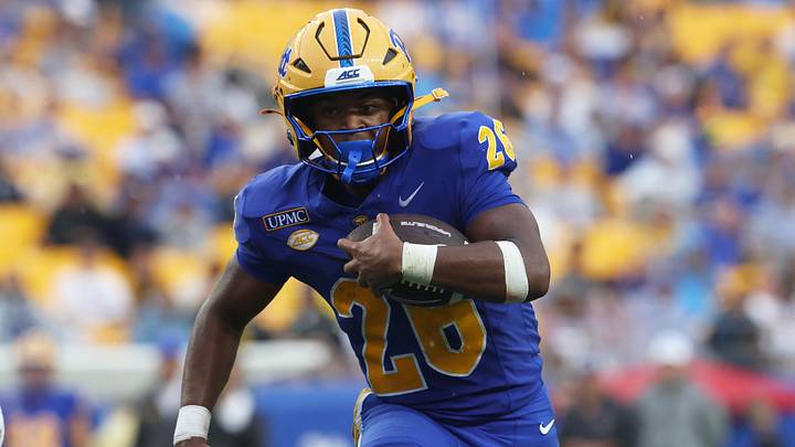 Sep 12, 2026; Pittsburgh, Pennsylvania, USA; Pittsburgh Panthers running back Damon Ferguson Jr. (26) rushes the ball on his way to scoring a thirteen yard touchdown against the UCF Knights during the second quarter at Acrisure Stadium. Mandatory Credit: Charles LeClaire-Imagn Images Sep 12, 2026; Pittsburgh, Pennsylvania, USA; Pittsburgh Panthers running back Damon Ferguson Jr. (26) rushes the ball on his way to scoring a thirteen yard touchdown against the UCF Knights during the second quarter at Acrisure Stadium. Mandatory Credit: Charles LeClaire-Imagn Images