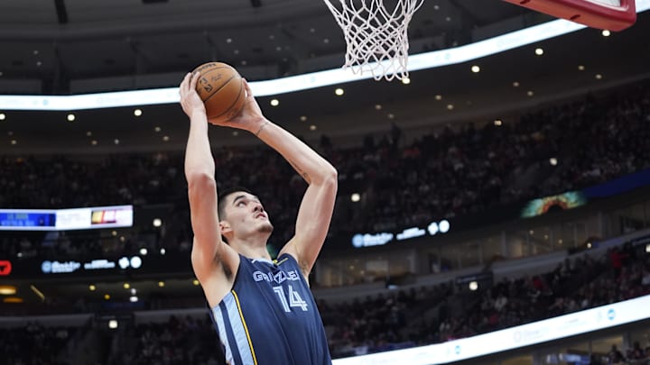 Oct 12, 2024; Chicago, Illinois, USA; Memphis Grizzlies center Zach Edey (14) goes to the basket against the Chicago Bulls during the first half at United Center. Mandatory Credit: David Banks-Imagn Images