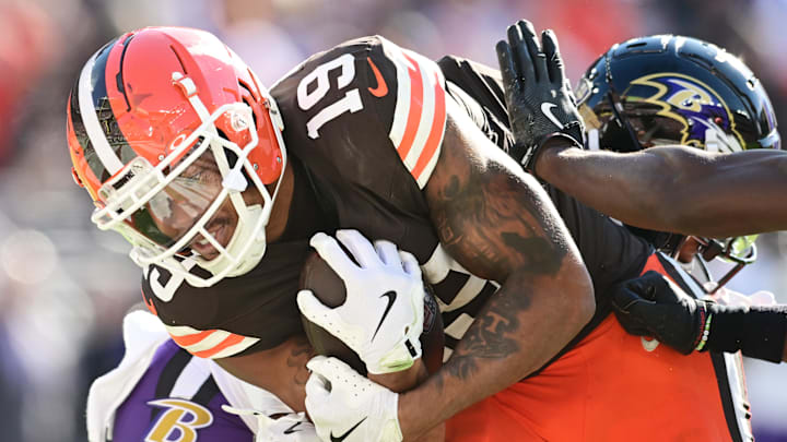Oct 27, 2024; Cleveland, Ohio, USA; Cleveland Browns wide receiver Cedric Tillman (19) runs with the ball after a catch en route to a touchdown as Baltimore Ravens safety Eddie Jackson (39) defends during the second half at Huntington Bank Field. Mandatory Credit: Ken Blaze-Imagn Images