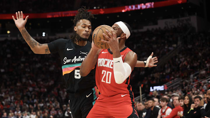 Jan 20, 2026; Houston, Texas, USA;Houston Rockets guard Josh Okogie (20) is fouled by San Antonio Spurs guard Stephon Castle (5)  in the first quarter at Toyota Center. Mandatory Credit: Thomas Shea-Imagn Images