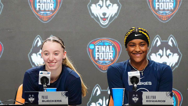 Apr 4, 2024; Cleveland, OH, USA; UConn Huskies coach Geno Auriemma (left), guard Paige Bueckers (center) and forward Aaliyah Edwards during press conference at Rocket Mortgage FieldHouse. Mandatory Credit: Kirby Lee-Imagn Images Apr 4, 2024; Cleveland, OH, USA; UConn Huskies coach Geno Auriemma (left), guard Paige Bueckers (center) and forward Aaliyah Edwards during press conference at Rocket Mortgage FieldHouse. Mandatory Credit: Kirby Lee-Imagn Images