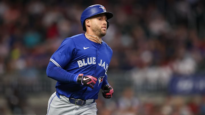 Toronto Blue Jays designated hitter George Springer (4) hits a single against the Atlanta Braves in the seventh inning at Truist Park on Sept 6.