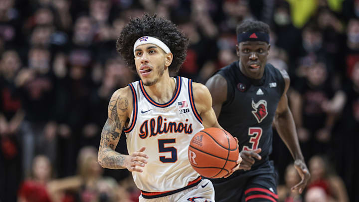 Feb 16, 2022; Piscataway, New Jersey, USA; Illinois Fighting Illini guard Andre Curbelo (5) dribbles up court in front of Rutgers Scarlet Knights forward Mawot Mag (3) during the first half at Jersey Mike's Arena. Mandatory Credit: Vincent Carchietta-Imagn Images Feb 16, 2022; Piscataway, New Jersey, USA; Illinois Fighting Illini guard Andre Curbelo (5) dribbles up court in front of Rutgers Scarlet Knights forward Mawot Mag (3) during the first half at Jersey Mike's Arena. Mandatory Credit: Vincent Carchietta-Imagn Images
