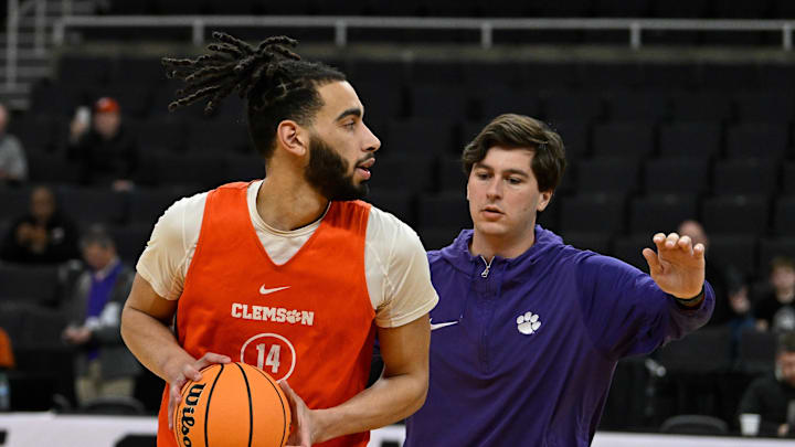 Mar 19, 2025; Providence, RI, USA; Clemson Tigers center Christian Reeves (14) works with a coaching assistant at a practice at Amica Mutual Pavilion.