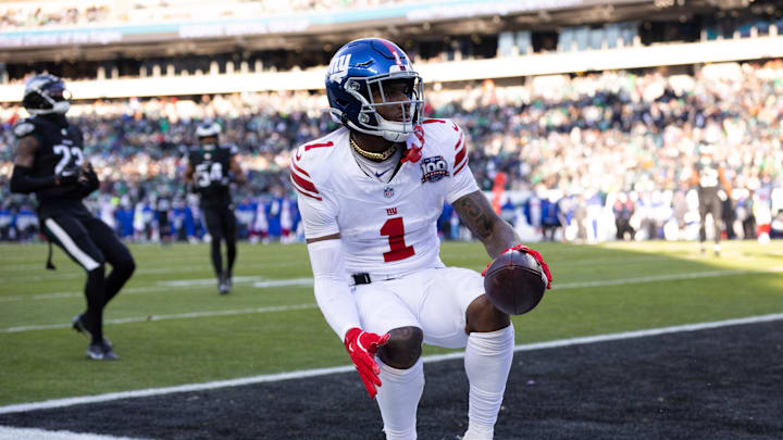 Jan 5, 2025; Philadelphia, Pennsylvania, USA; New York Giants wide receiver Malik Nabers (1) scores a touchdown against the Philadelphia Eagles during the fourth quarter at Lincoln Financial Field.  