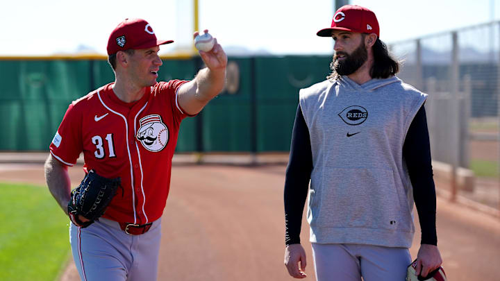 Feb 20, 2024; Goodyear, AZ, USA; Cincinnati Reds relief pitcher Brent Suter (31), left, and Cincinnati Reds relief pitcher Tejay Antone (70), right, talk after long tossing during spring training workouts at Goodyear Ballpark. Mandatory Credit: Kareem Elgazzar-Imagn Images