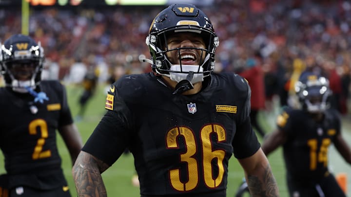 Dec 1, 2024; Landover, Maryland, USA; Washington Commanders running back Chris Rodriguez Jr. (36) celebrates after scoring a touchdown against the Tennessee Titans during the fourth quarter at Northwest Stadium. Mandatory Credit: Geoff Burke-Imagn Images