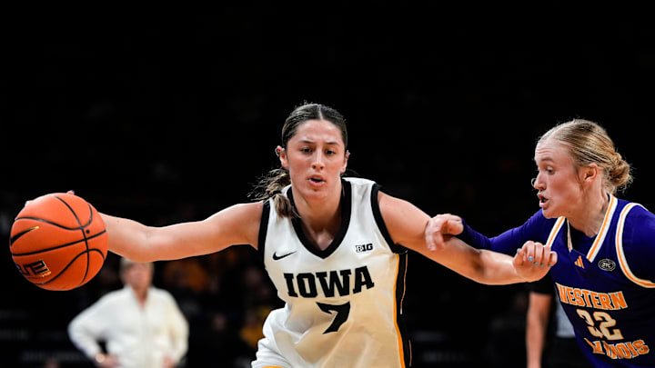 Iowa guard Addie Deal (7) dribbles the ball as Western Illinois guard Kaylen Reed (32) defends Nov. 26, 2025 at Carver-Hawkeye Arena in Iowa City, Iowa.