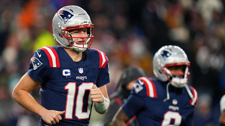 Jan 4, 2026; Foxborough, Massachusetts, USA; New England Patriots quarterback Drake Maye (10) and wide receiver Kayshon Boutte (9) run off the field after a Patriots touchdown against the Miami Dolphins during the second half at Gillette Stadium. Mandatory Credit: David Butler II-Imagn Images