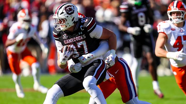 Nov 29, 2025; Columbia, South Carolina, USA; South Carolina Gamecocks tight end Brady Hunt (87) is stopped by Clemson Tigers safety Khalil Barnes (7) in the first quarter at Williams-Brice Stadium. Mandatory Credit: Jeff Blake-Imagn Images Nov 29, 2025; Columbia, South Carolina, USA; South Carolina Gamecocks tight end Brady Hunt (87) is stopped by Clemson Tigers safety Khalil Barnes (7) in the first quarter at Williams-Brice Stadium. Mandatory Credit: Jeff Blake-Imagn Images