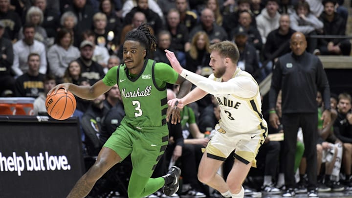 Nov 23, 2024; West Lafayette, Indiana, USA; Marshall Thundering Herd guard Dezayne Mingo (3) drives past Purdue Boilermakers guard Braden Smith (3) during the first half at Mackey Arena. Mandatory Credit: Marc Lebryk-Imagn Images Nov 23, 2024; West Lafayette, Indiana, USA; Marshall Thundering Herd guard Dezayne Mingo (3) drives past Purdue Boilermakers guard Braden Smith (3) during the first half at Mackey Arena. Mandatory Credit: Marc Lebryk-Imagn Images
