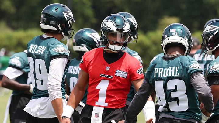 Jun 10, 2026; Philadelphia, PA, USA; Philadelphia Eagles quarterback Jalen Hurts (1) reacts with teammates during minicamp at Jefferson Health Training Complex. 