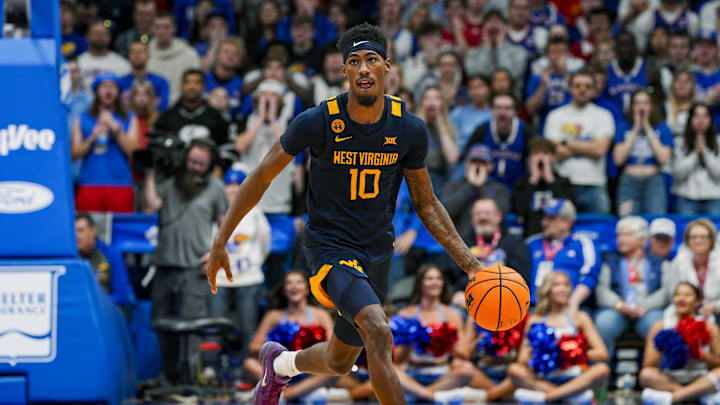 Dec 31, 2024; Lawrence, Kansas, USA; West Virginia Mountaineers guard Sencire Harris (10) dribbles the ball during the first half against the Kansas Jayhawks at Allen Fieldhouse. Mandatory Credit: Jay Biggerstaff-Imagn Images Dec 31, 2024; Lawrence, Kansas, USA; West Virginia Mountaineers guard Sencire Harris (10) dribbles the ball during the first half against the Kansas Jayhawks at Allen Fieldhouse. Mandatory Credit: Jay Biggerstaff-Imagn Images