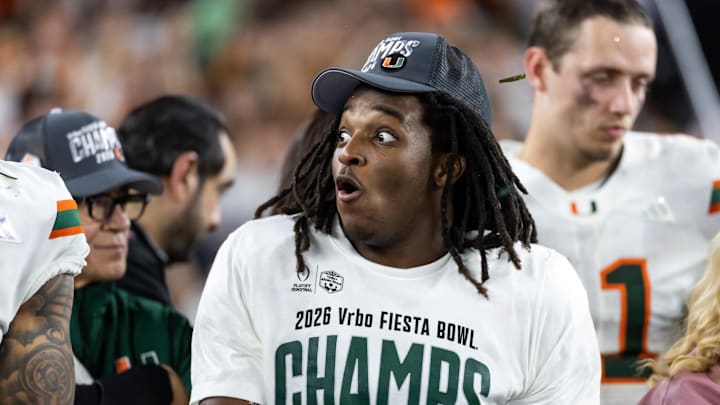 Miami star wide receiver Malachi Toney was consoled by Ed Reed after their loss to Indiana in the national championship game.