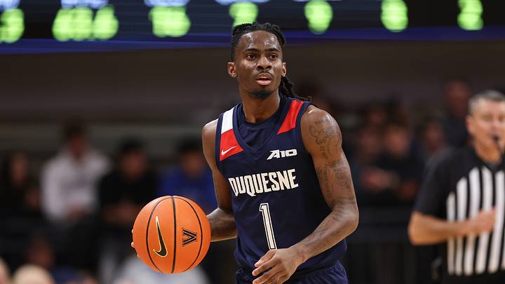 Nov 15, 2025; Villanova, Pennsylvania, USA; Duquesne Dukes guard Tarence Guinyard (1) dribbles up court against the Villanova Wildcats during the second half at William B. Finneran Pavilion. Mandatory Credit: Bill Streicher-Imagn Images