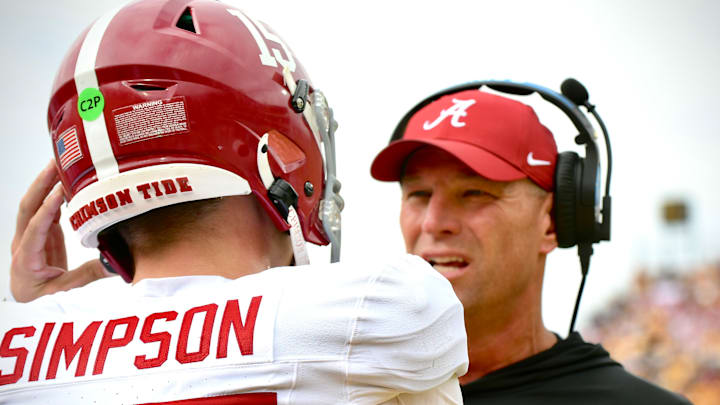 Oct 11, 2025; Columbia, MO, USA; Alabama Crimson Tide coach Kalen DeBoer talks with quarterback Ty Simpson (15) during a timeout in the first quarter against the Missouri Tigers at Faurot Field at Memorial Stadium. 