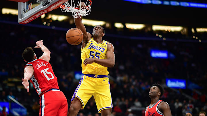 Feb 4, 2025; Inglewood, California, USA; Los Angeles Lakers center Trey Jemison III (55) dunks for the basket against Los Angeles Clippers forward Drew Eubanks (15) during the second half at Intuit Dome. Mandatory Credit: Gary A. Vasquez-Imagn Images