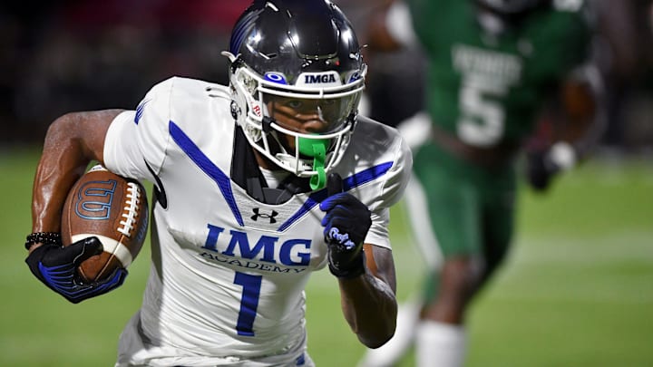 IMG Academy wide receiver Donovan Olugbode (#1) looks to gain extra yardage against the Venice defense. The Venice High School Indians hosted the IMG Academy Ascenders National team on Friday, Oct. 4, 2024.