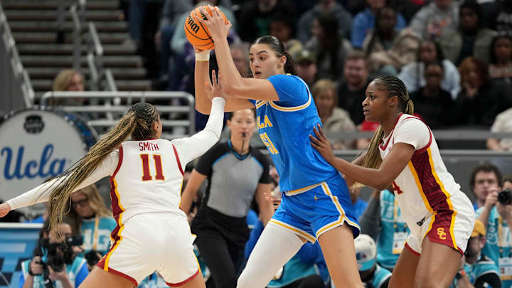 USC Trojans guard Kennedy Smith (11) and center Clarice Akunwafo (34) guard UCLA Bruins center Lauren Betts (51) during the second half of the 2025 TIAA Big Ten Women's Basketball Tournament final game on Sunday, March 9, 2025, at Gainbridge Fieldhouse in Indianapolis. UCLA defeated USC 72-67.