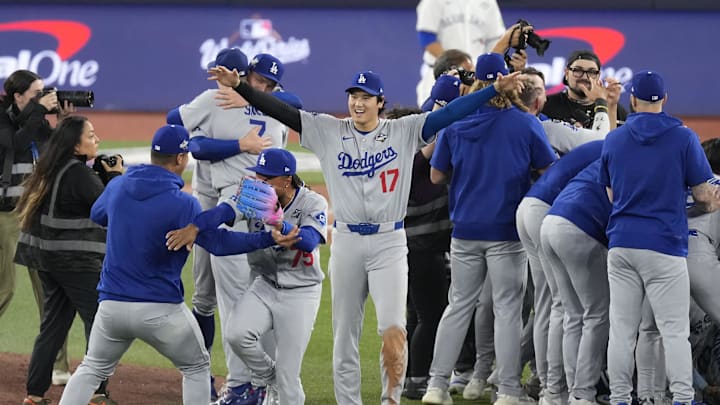 Nov 1, 2025; Toronto, Ontario, CAN; Los Angeles Dodgers two-way player Shohei Ohtani (17) celebrates with teammates after defeating the Toronto Blue Jays in game seven of the 2025 MLB World Series at Rogers Centre. Mandatory Credit: Kevin Sousa-Imagn Images
