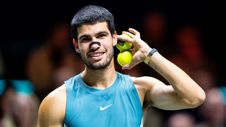 Carlos Alcaraz signals to the crowd at Rotterdam. Carlos Alcaraz signals to the crowd at Rotterdam.