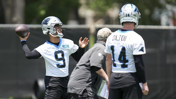 Jun 11, 2025; Charlotte, NC, USA;  Carolina Panthers quarterback Andy Dalton (14) watches quarterback Bryce Young (9) throw during minicamp at Bank of America Stadium. Mandatory Credit: Jim Dedmon-Imagn Images