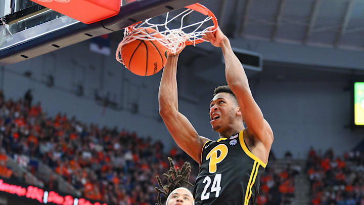 Dec 30, 2023; Syracuse, New York, USA; Pittsburgh Panthers forward William Jeffress (24) dunks as Syracuse Orange forward Benny Williams (back) defends during the first half at the JMA Wireless Dome. Mandatory Credit: Rich Barnes-Imagn Images
